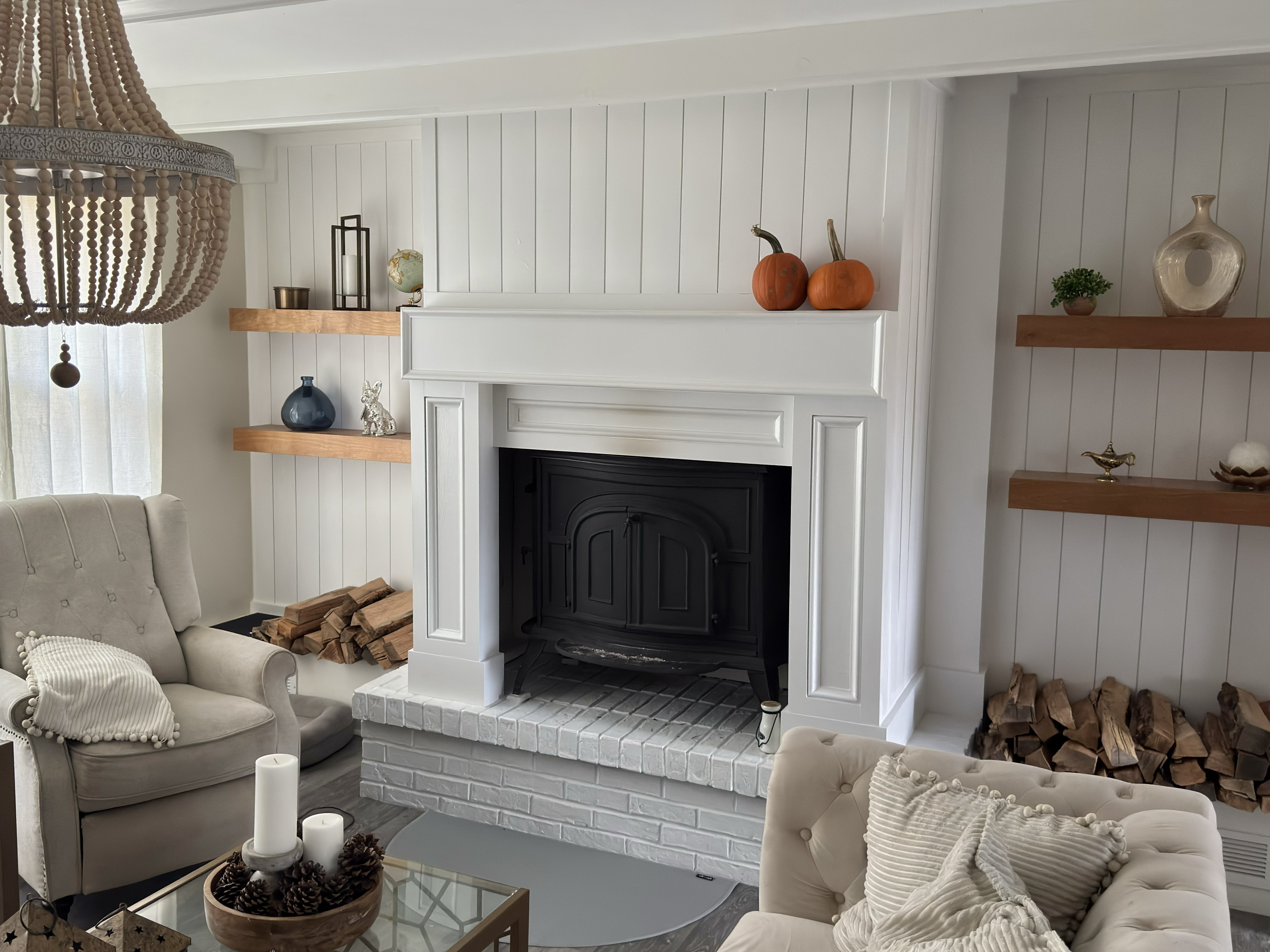 Chimney fireplace with new moulding, shelves, and whitewashed brick